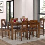 Handcrafted sheesham wood dining table with elegant design.